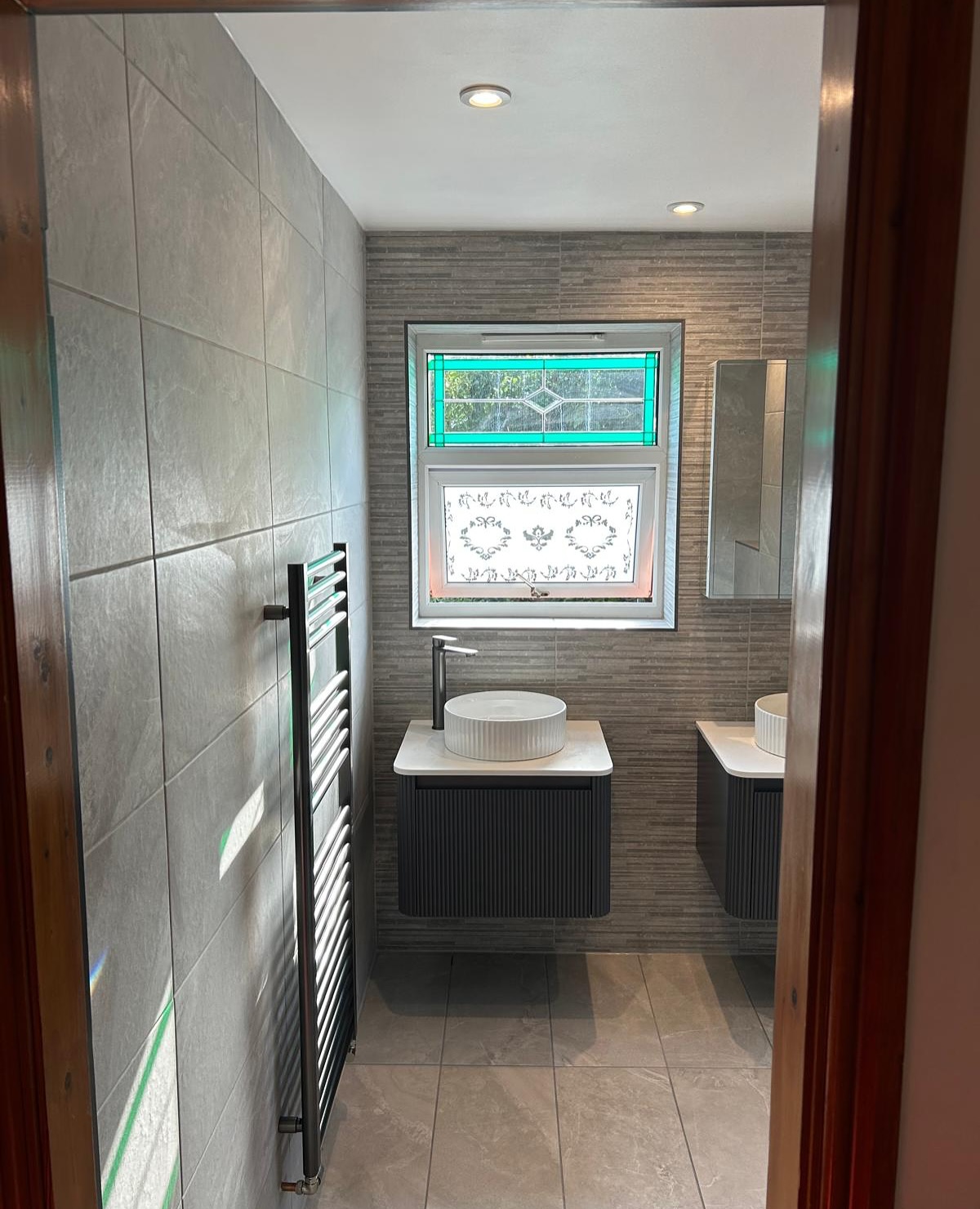 Large bathroom with individual sinks in Stannington